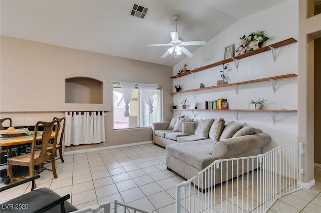 2595 Fort Lauderdale Dr, Las Vegas, NV 89156 - living area featuring vaulted ceiling, a ceiling fan, light tile patterned floors, and baseboards
