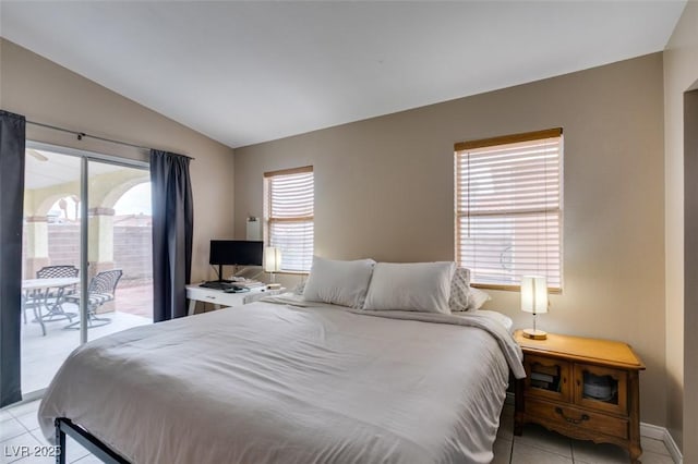 2595 Fort Lauderdale Dr, Las Vegas, NV 89156 - bedroom featuring access to exterior, light tile patterned floors, lofted ceiling, multiple windows, and baseboards
