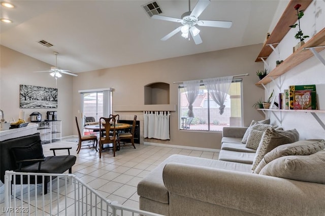 2595 Fort Lauderdale Dr, Las Vegas, NV 89156 - living area with ceiling fan, light tile patterned flooring, vaulted ceiling, baseboards, and recessed lighting
