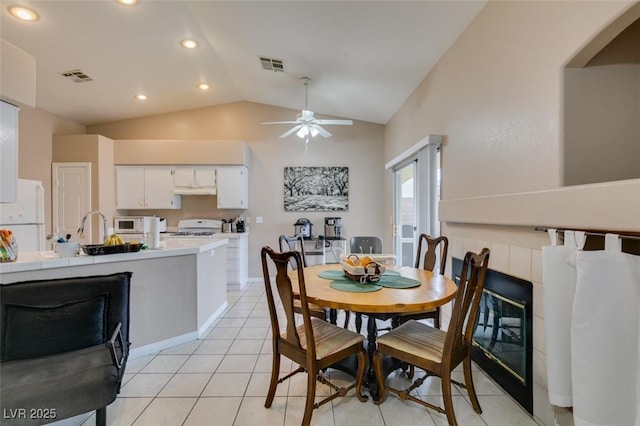 2595 Fort Lauderdale Dr, Las Vegas, NV 89156 - dining space featuring lofted ceiling, ceiling fan, recessed lighting, light tile patterned flooring, and arched walkways