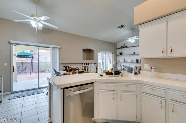 2595 Fort Lauderdale Dr, Las Vegas, NV 89156 - kitchen with dishwasher, a ceiling fan, vaulted ceiling, a peninsula, and a sink
