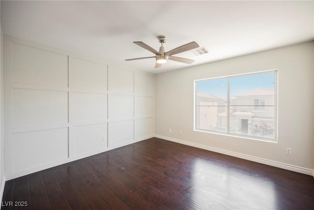 unfurnished bedroom featuring ceiling fan, baseboards, visible vents, and wood finished floors