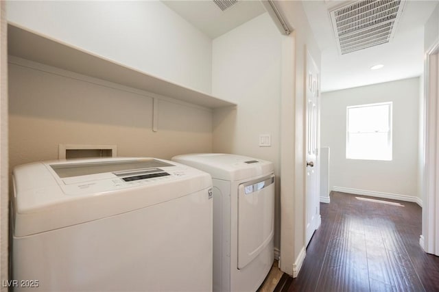 laundry room with washer and dryer, dark wood-style flooring, laundry area, baseboards, and visible vents