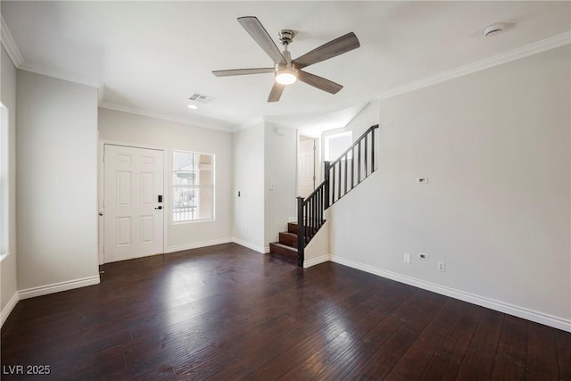 foyer with wood-type flooring, a ceiling fan, baseboards, visible vents, and stairway
