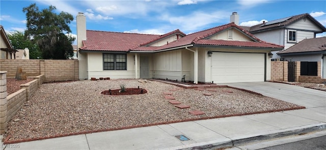 4308 Apex Dr, Las Vegas, NV 89147 - view of front of property with fence, a chimney, concrete driveway, and a garage