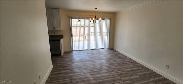 4308 Apex Dr, Las Vegas, NV 89147 - unfurnished dining area with baseboards, ornamental molding, dark wood-style flooring, and a chandelier