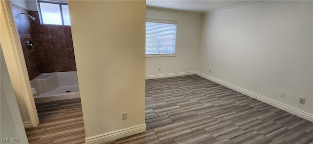 4308 Apex Dr, Las Vegas, NV 89147 - full bathroom with ornamental molding, wood finished floors, toilet, baseboards, and a tile shower