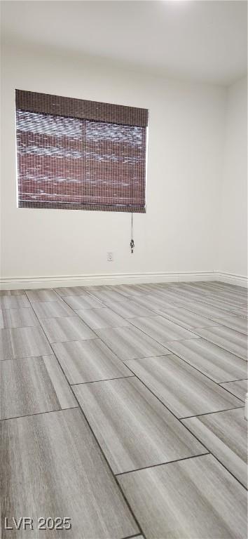 4308 Apex Dr, Las Vegas, NV 89147 - spare room with baseboards and wood finished floors