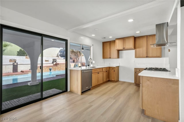 kitchen featuring gas cooktop, a sink, light wood-style flooring, dishwasher, and exhaust hood
