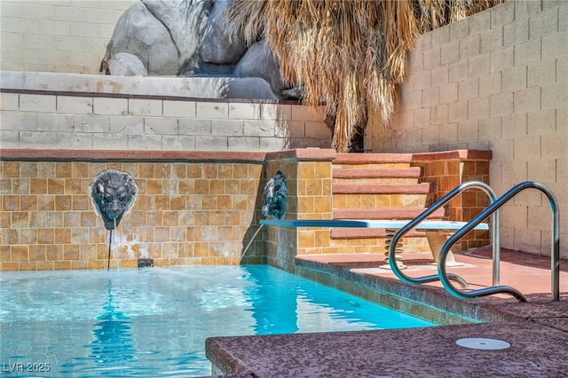 exterior details with a swimming pool