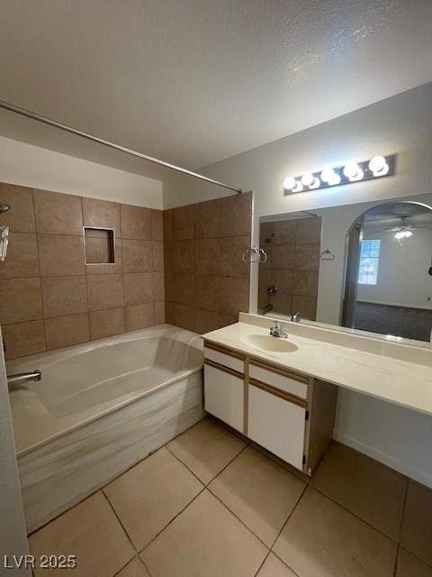 full bathroom with ceiling fan, shower / washtub combination, tile patterned flooring, and vanity