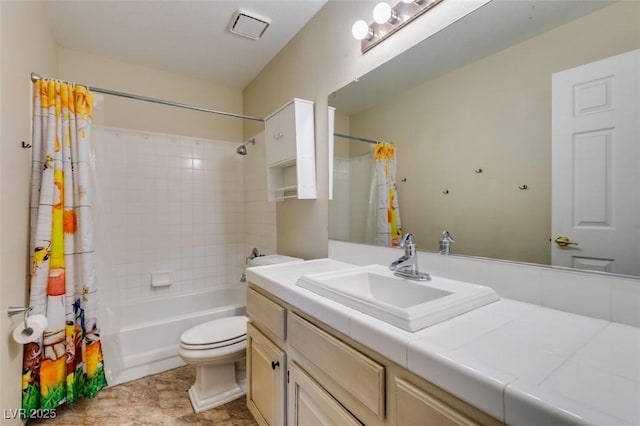 bathroom with vanity, toilet, visible vents, and shower / tub combo