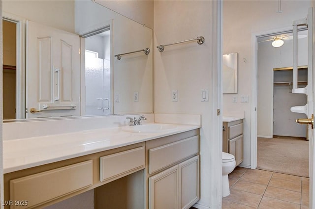 full bathroom featuring vanity, tile patterned flooring, and toilet