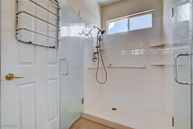 full bath with tile patterned flooring and a stall shower