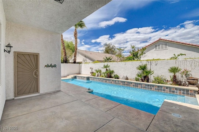 view of swimming pool with a fenced in pool, a fenced backyard, and a patio area