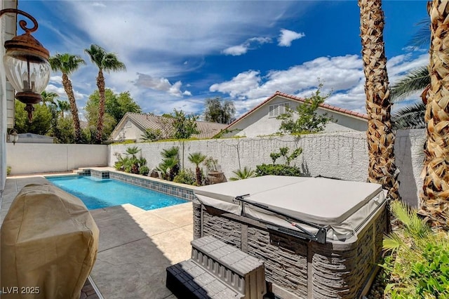 view of pool with a fenced in pool, a fenced backyard, and a patio area