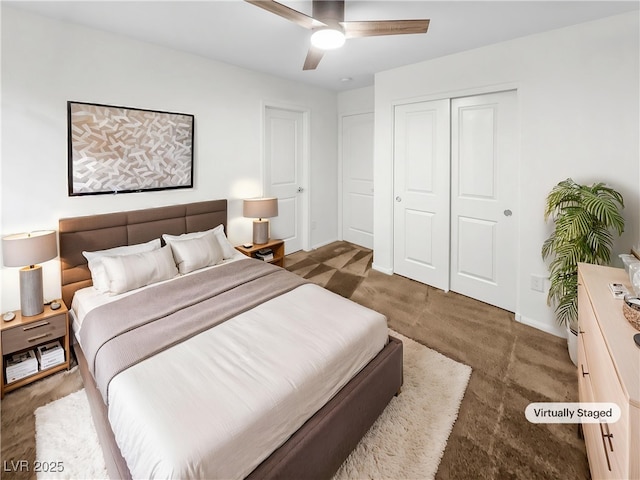 bedroom with a closet, baseboards, carpet floors, and ceiling fan