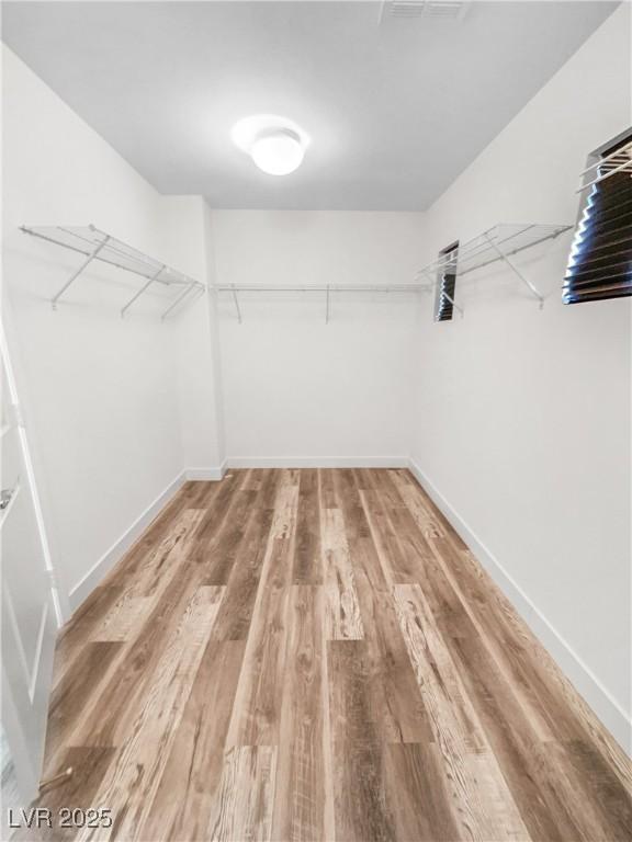 walk in closet featuring light wood-style floors