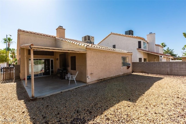 2805 Rungsted St, Las Vegas, NV 89142 - rear view of property with a fenced backyard, stucco siding, and a patio area