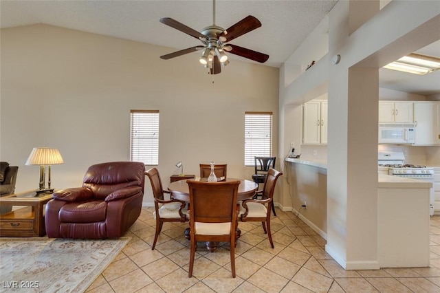 2805 Rungsted St, Las Vegas, NV 89142 - dining space with ceiling fan, plenty of natural light, light tile patterned floors, and lofted ceiling