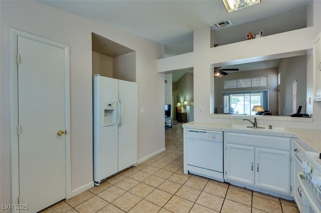 2805 Rungsted St, Las Vegas, NV 89142 - kitchen featuring visible vents, white appliances, ceiling fan, tile counters, and light tile patterned floors