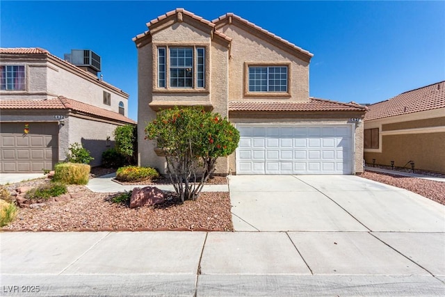 6428 Yarmouth Dr, Las Vegas, NV 89108 - traditional-style house with central AC, a garage, stucco siding, concrete driveway, and a tiled roof