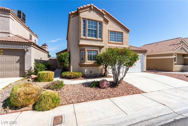 6428 Yarmouth Dr, Las Vegas, NV 89108 - traditional home featuring driveway, a tile roof, and stucco siding