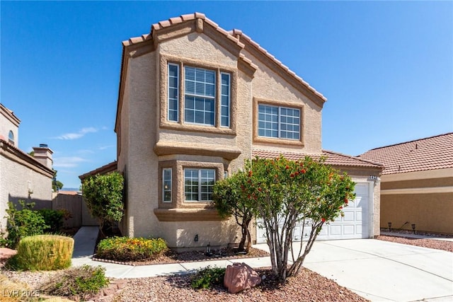 6428 Yarmouth Dr, Las Vegas, NV 89108 - traditional-style home featuring concrete driveway, an attached garage, a tile roof, and stucco siding