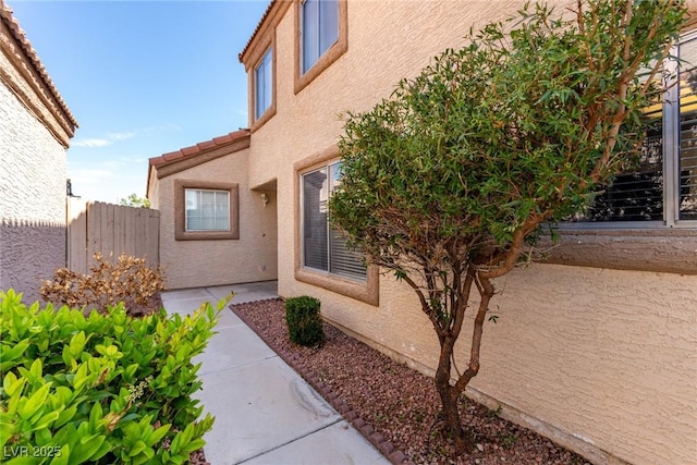 6428 Yarmouth Dr, Las Vegas, NV 89108 - property entrance featuring fence, a patio, and stucco siding
