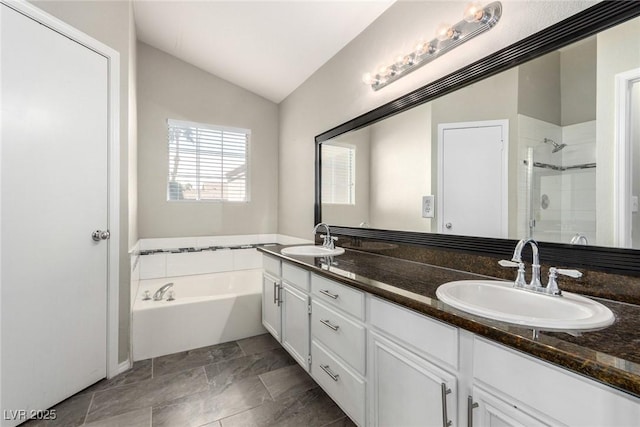 6428 Yarmouth Dr, Las Vegas, NV 89108 - bathroom with a sink, a bath, a stall shower, and vaulted ceiling