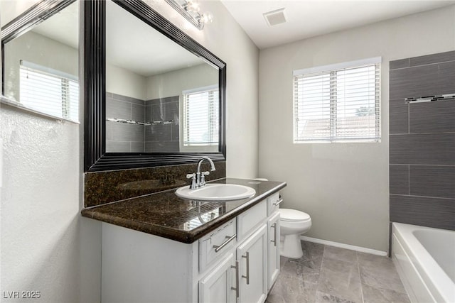 6428 Yarmouth Dr, Las Vegas, NV 89108 - full bathroom with vanity, baseboards, toilet, and a shower
