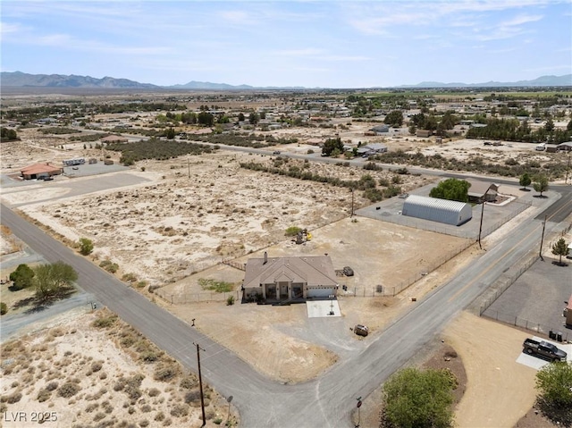 aerial view featuring a rural view, a mountain view, and view of desert
