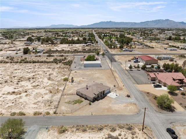 aerial view with view of desert, a mountain view, and a rural view
