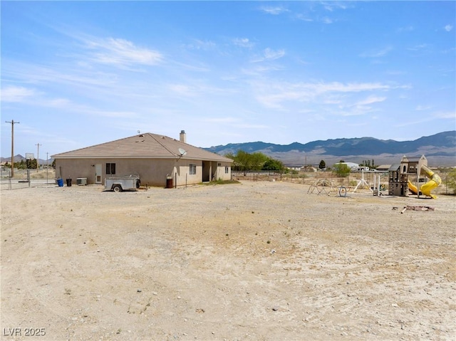 exterior space with a mountain view and playground community