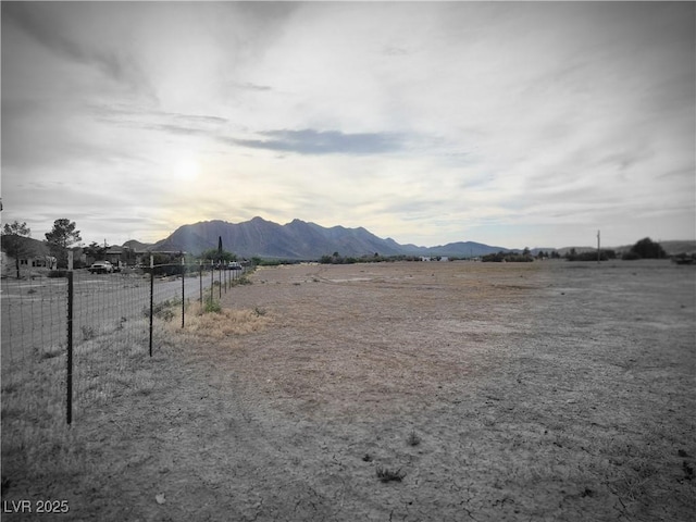 exterior space with fence and a mountain view