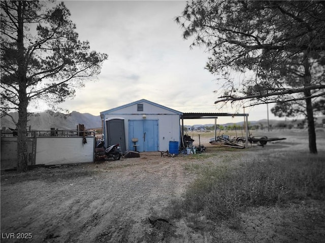 view of shed with a mountain view