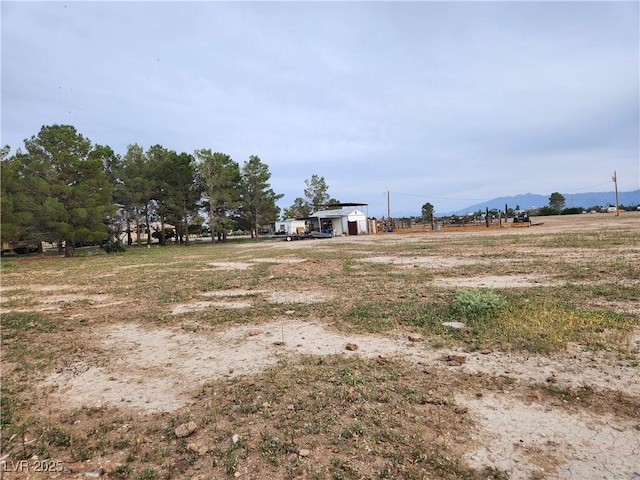 view of yard with a rural view
