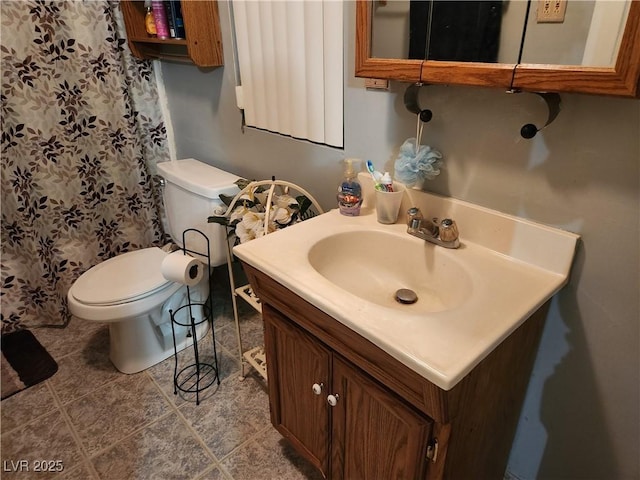 full bath with toilet, tile patterned flooring, and vanity