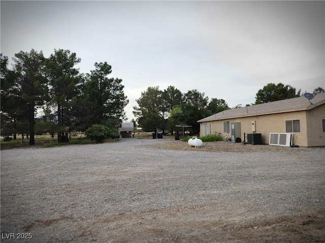 view of yard featuring central air condition unit
