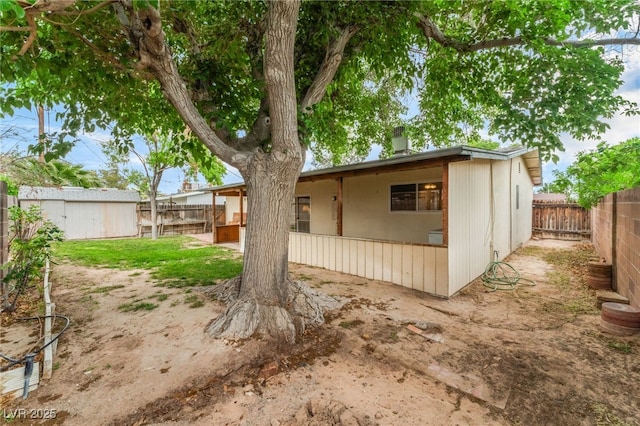 exterior space featuring a fenced backyard
