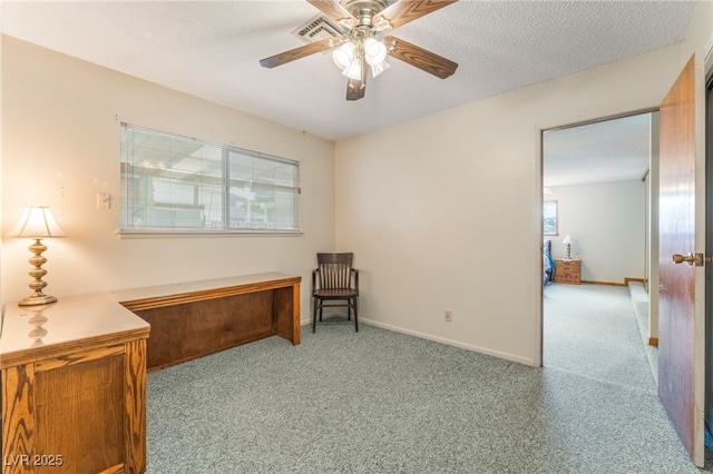 living area featuring baseboards, a ceiling fan, carpet flooring, and visible vents