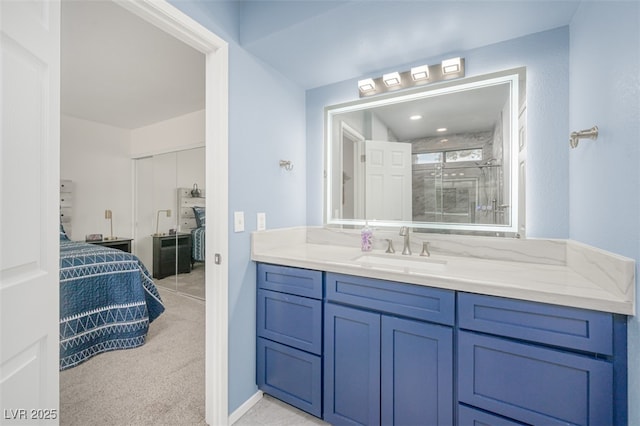full bathroom with vanity and a stall shower