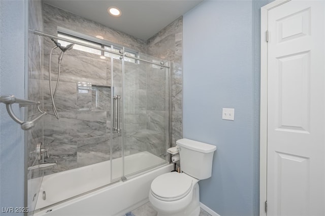 bathroom with baseboards, bath / shower combo with glass door, and toilet