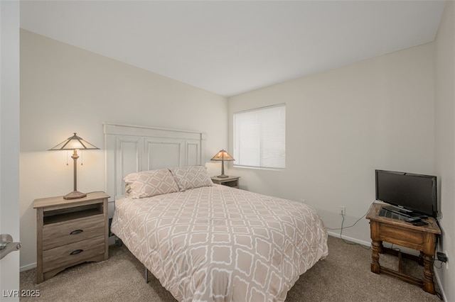 carpeted bedroom featuring baseboards