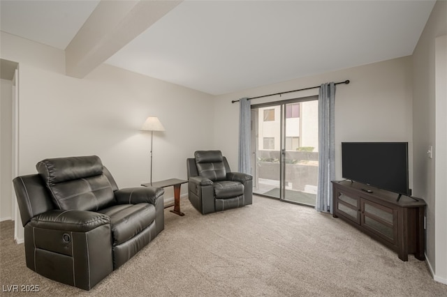 carpeted living area featuring baseboards and beamed ceiling