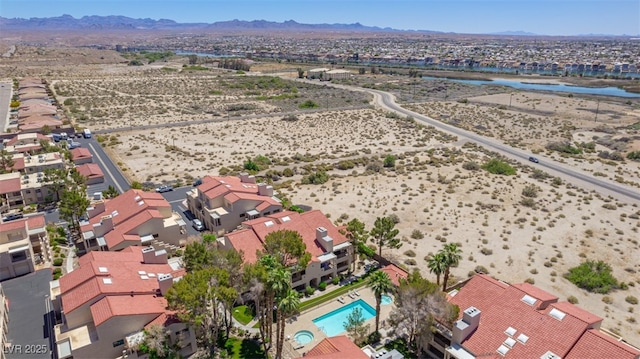 bird's eye view with a residential view, a mountain view, and view of desert