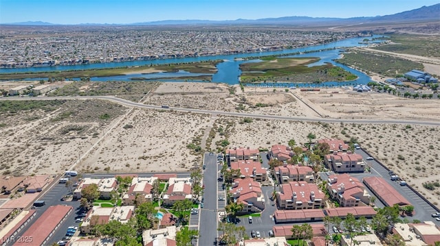 birds eye view of property with a water and mountain view and a residential view