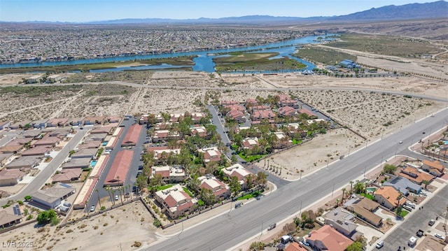 bird's eye view featuring a residential view and a water and mountain view