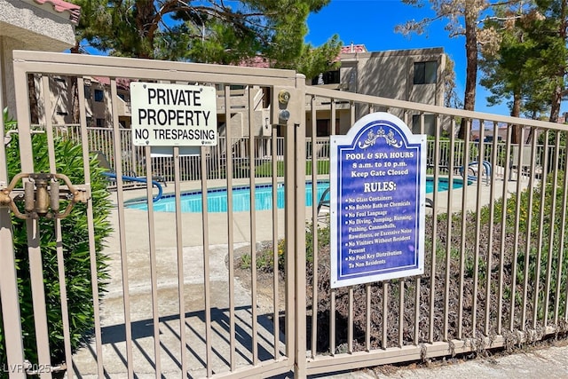 details with fence and a swimming pool