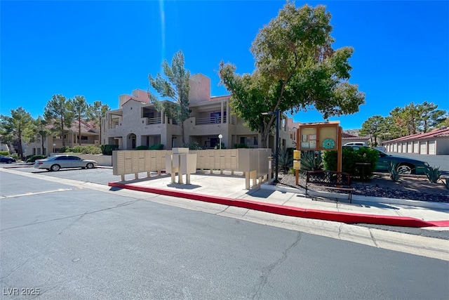 view of property with a residential view and stucco siding